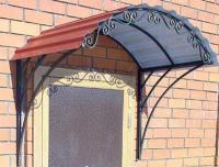 Кованый козырек черного цвета